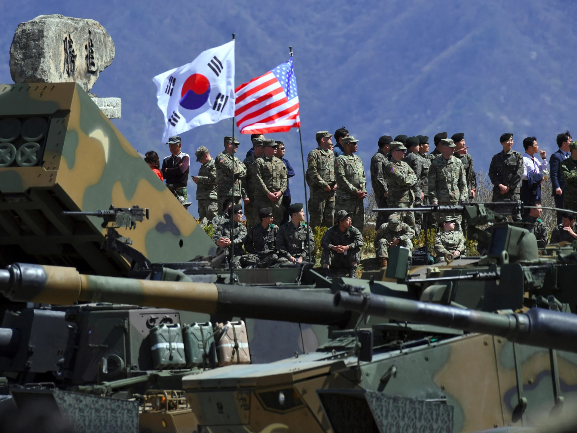 South Korean and US soldiers watching from an observation post during a joint live firing drill