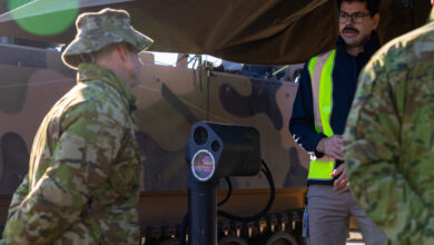 AIM Defence co-founder Dr Jae Daniel explains the operation of the AIM Defence Counter-UAS Directed Energy Weapons System to Australian Army Director General Future Land Warfare Brigadier James Davis at the Puckapunyal Military Area, Victoria. *** Local Caption *** The AIM Defence Counter-UAS Directed Energy Weapons System live-fire demonstration is the final stage of a joint RICO/Jericho investment spanning over five years. AIM Defence design, build, test, and manufacture high-powered laser solutions. The demonstration took place in Puckapunyal, Victoria on 27-31 May 2024 and showcased the Fractl Portable High Energy Laser and how it can be used by the Australian Army.