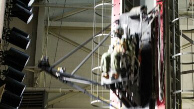 A test dummy equipped with a new modular handgun system is dropped at a rate of speed on a vertical deceleration tower inside the 711th Human Performance Wing, at Wright-Patterson Air Force Base, Ohio, Dec. 6, 2017. The drop is meant to simulate being ejected from an aircraft and tests the safety and durability of the new modular handgun system when exposed to the stresses associated with ejection from an aircraft. This is the first time any service has conducted this type of demonstration to ensure a side arm is safe for aircrew to carry in ejection seat aircraft. (U.S. Air Force photo by Wesley Farnsworth)