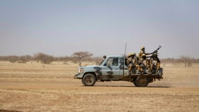 Burkinabe soldiers aboard a military vehicle