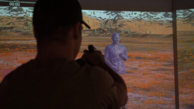 A Green Beret with 10th Special Forces Group (Airborne) fires at a target in the VirTra simulator on Fort Carson, Colorado, Feb. 2, 2024. The VirTra simulator features technology that can present different shooting scenarios, environments and targets to better help its users sharpen their shooting skills while providing realistic training. (U.S. Army photo by Sgt. David Cordova)