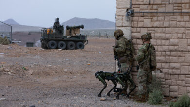 U.S. Soldiers assigned to the 1st Battalion, 29th Infantry Regiment, based out of Fort Moore, Ga., take part in a human machine integration demonstration using the Ghost Robotic Dog, and the U.S. Army Small Multipurpose Equipment Transport (SMET) of new U.S. Army capabilities at Project Convergence - Capstone 4 in Fort Irwin, Calif., March 15, 2024. The robotic dog is a mid-sized, high-endurance, agile unmanned ground vehicle that provides enhanced reconnaissance and situational awareness supporting Soldiers on the ground. The SMET is an eight-wheeled, enabling robotic technology serving as a “robotic mule” with a wide range of flexibility to operate in combat, combat support and combat service support operations. (U.S. Army photo by Spc. Samarion Hicks)