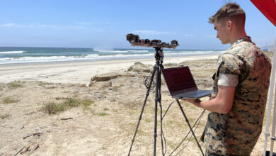 U.S. Marine Corps Cpl. Gideon Morrill, a weather forecaster from 1st Intelligence Battalion is introduced to LittoralLens, a computer-vision system enabling automated measurements of littoral surface water velocities and wave statistics affording an economical system, capable of computing real-time, littoral water wave characteristics and water surface velocities to support naval tactical decision for operational maneuvers from the sea for manned and unmanned assets at Marine Corps Base Camp Pendleton in Oceanside, Calif., Aug. 1, 2023. (U.S. Naval Research Laboratory photo)