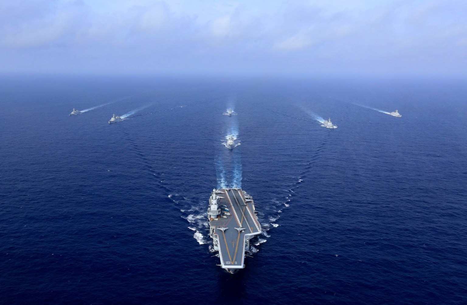 China's Liaoning aircraft carrier (C) sailing during a drill in the South China Sea, April 18, 2018. Photo: AFP/Getty Images