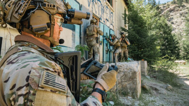 Soldier operating a robotic system controller