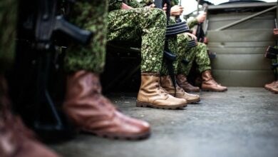 Colombian navy military soldiers sit on a transport truck