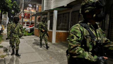 Soldiers patrol a street in Cali, Colombia