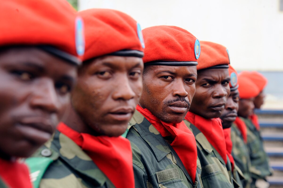 Members of the Democratic Republic of the Congo's military police force line up to prepare for a distinguished visitor entrance