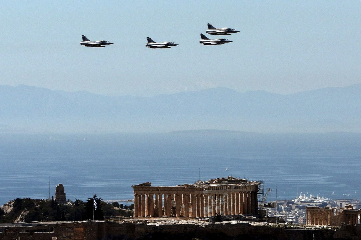 Fighter jets fly over the Parthenon at the Acropolis on March 25, 2017 in Athens, during a military parade marking Greece's Independence Day.