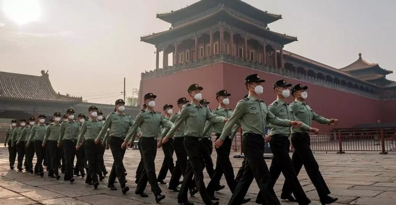 People's Liberation Army (PLA) soldiers march during the opening ceremony of the Chinese People's Political Consultative Conference (CPPCC) in Beijing