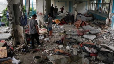 Palestinians look through a UN school that was hit during Israeli bombardment in Nuseirat, in the central Gaza Strip, on June 6, 2024.