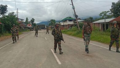 Indian security forces personnel stand guard in India's north-eastern Manipur state