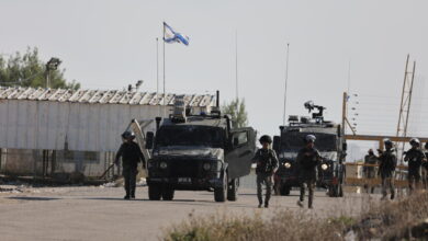 Israeli border police stand guard outside Ofer military camp in the occupied West Bank