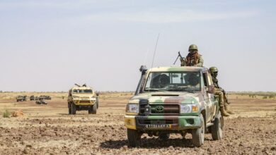 Military pick-up and an armored vehicle 'Bastion' of the Malian army.