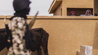 Two women stand out behind a wall in Ngarannam village, located in Borno in north-eastern Nigeria, which was the stronghold of the terrorist organization Boko Haram