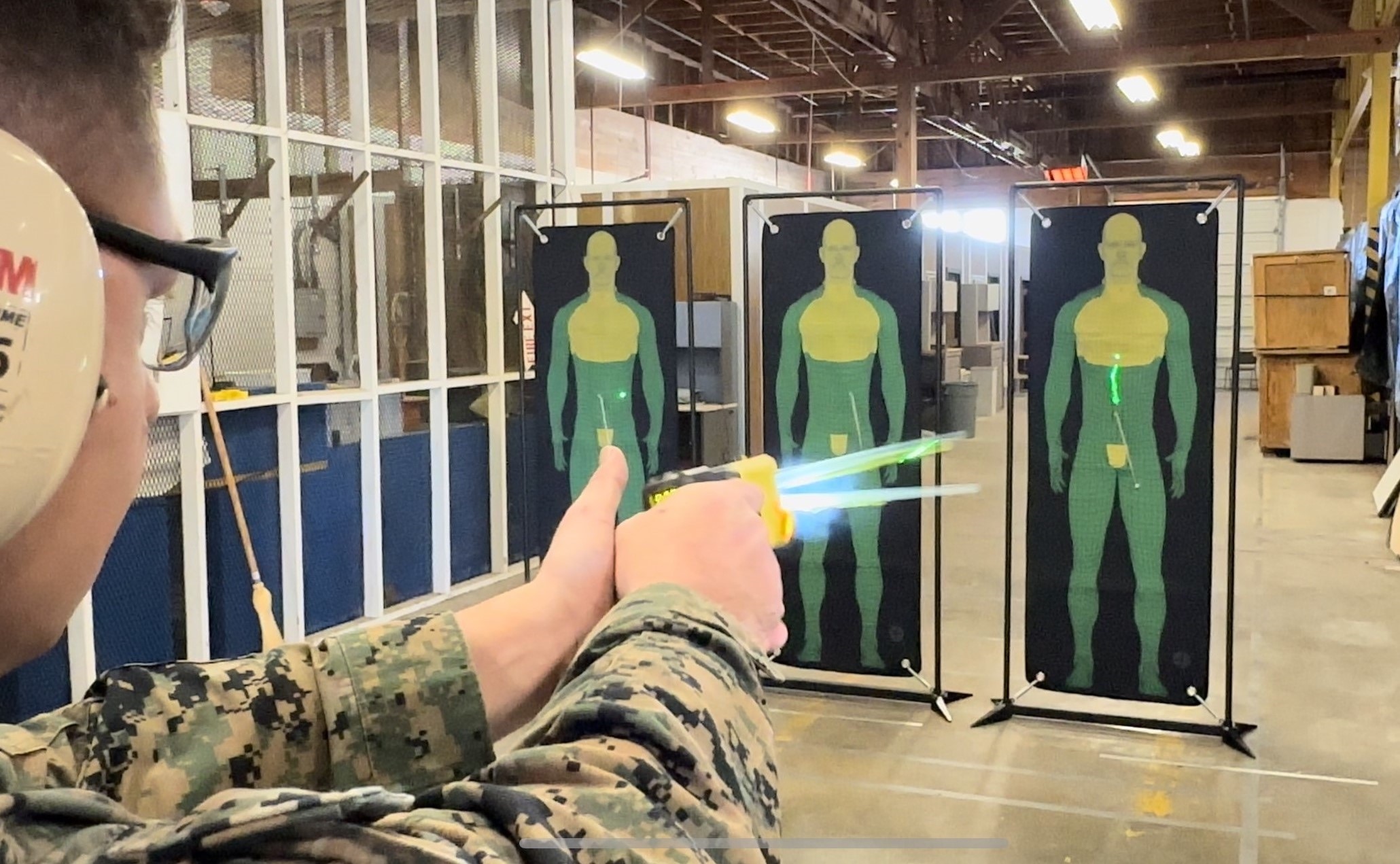 Gunnery fires a next-generation human electro-muscular incapacitation device at a target during a limited user evaluation hosted by Air Force Security Forces Center