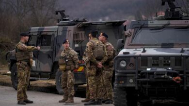 NATO peacekeeping soldiers patrol near the town of Zvecan in Kosovo