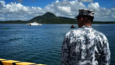 Philippine Coast Guard prepares to receive the crew of the USCGC Frederick Hatch (WPC 1143) at the pier in Tacloban, Philippines