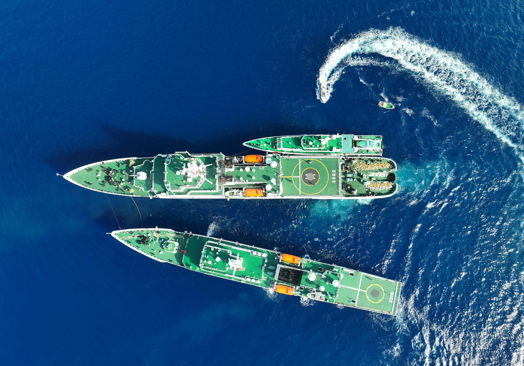 The vessel "China Coast Guard (CCG) 3502" carrying out replenishment for other vessels in the South China Sea