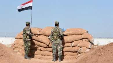 Syrian regime forces manning a position in the countryside city of Kobane, also known as Ain al-Arab, along the border with Turkey