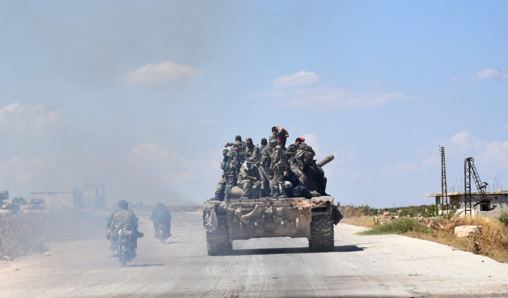 Syrian soldiers are seen in the town of Morek in the northern countryside of Hama province in central Syria, 2019