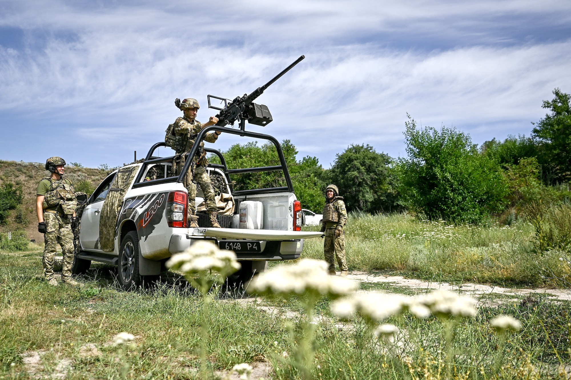 Fighters of the Separate Anti-Aircraft Machine Gun Battalion seen during shooting practice with a Browning heavy machine gun in Zaporizhzhia region, southeastern Ukraine