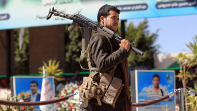 A fighter loyal to Houthi rebels visits the grave of slain Houthi political leader Saleh al-Sammad in Yemen's Houthi rebel-held capital, Sanaa, on 31 January 2022