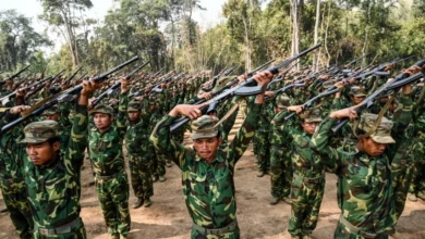 Members of the ethnic rebel group Ta'ang National Liberation Army (TNLA) take part in a training exercise at their base camp in the forest in Myanmar's northern Shan State